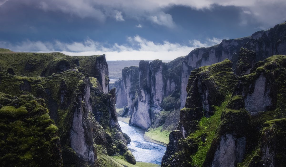 A winding river between tall, green cliffs